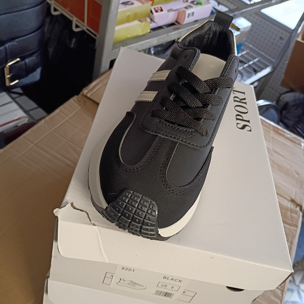Black Athletic Sneaker with White Stripes